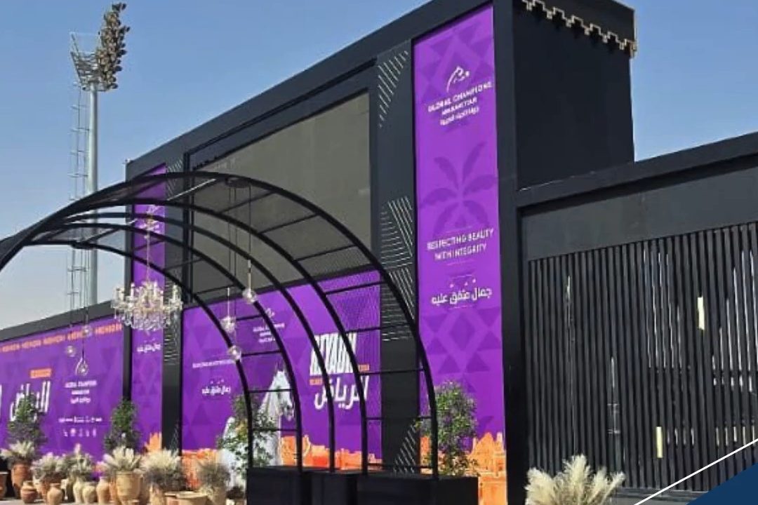 An event facade with banners, a built arch and a lit fascia